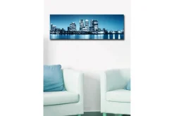 Lerretsbilde med LED-belysning 30x90 cm - Bysilhuett med moderne skyskrapere ved vannkanten